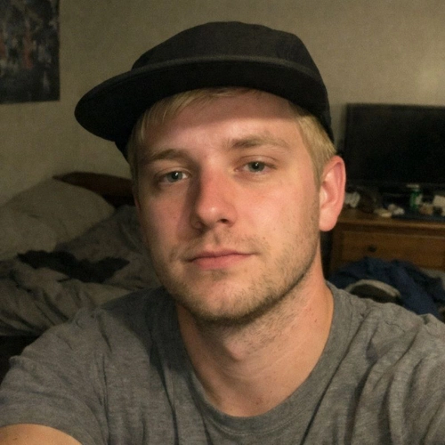 selfie of boy wearing cap in his bedroom